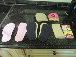 Outer fabric, fleece inner fabric, and canvas sole fabric all cut and ready to go. 