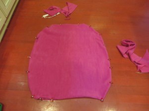 Two lower portions of cape pinned and ready to be sewn. * Remember to leave your top seam open as your turning hole!