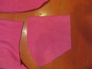 Upper body portion of cape cut, folded in half.