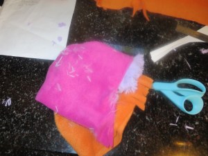 Visor sewn into pink bonnet piece.