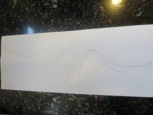 Paper folded in half with half of pad drafted.
