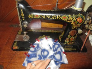 Two three-panel sections of like fabric clipped together, right sides facing each other.