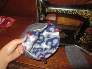 Hats inside one another, right sides together and clipped for sewing.