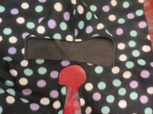 Half-circle opening enlarged to accommodate hood.