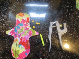 Completed pad, snaps, and snap pliers.