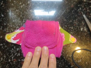 2.  Fold top flap over bottom flap.