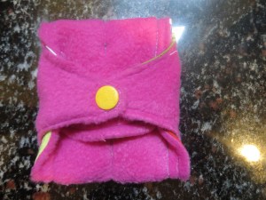 4. Snap left flap. 